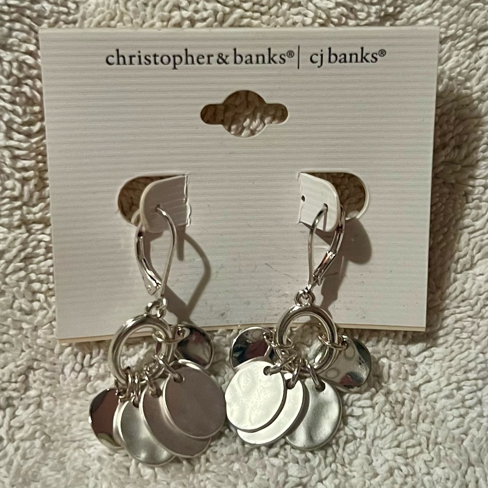 Silver discs that are a mix of hammered and shiny silver